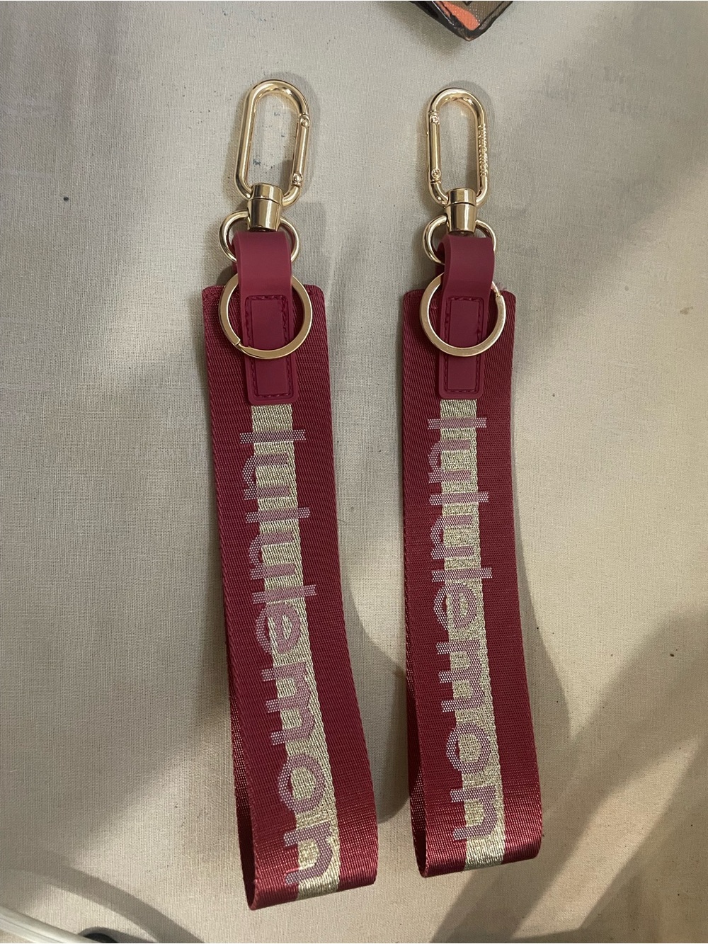 lululemon athletica burgundy key strap with gold hardware